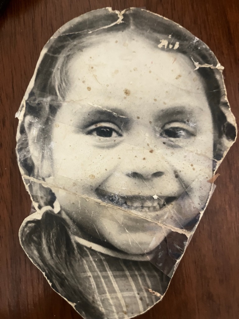 Original severely damaged and torn childhood photograph